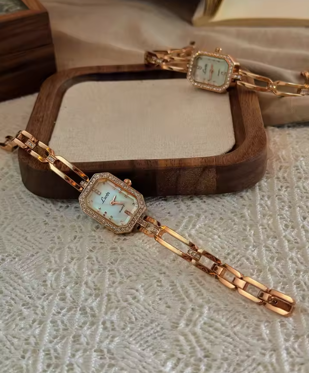 Rose gold rectangular bracelet watch with diamond crystal bezel and open-link chain band for women by Le Belle Heure
