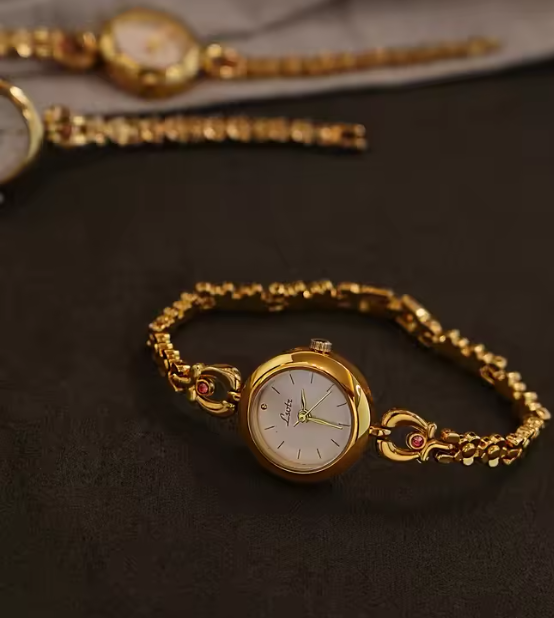 Gold vintage floral rose chain bracelet watch with white round dial and ruby accent for women by Le Belle Heure
