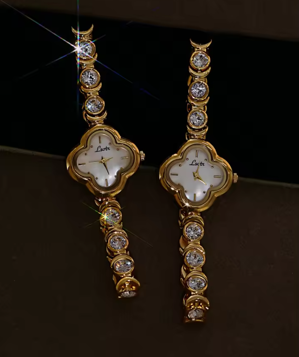 Gold four-leaf clover shaped mother-of-pearl dial quartz watch on a bezel-set round crystal tennis bracelet for women by Le Belle Heure