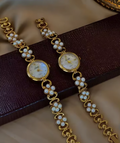 Gold oval dial ladies bracelet watch with pearl flower cluster links and Roman numerals by Le Belle Heure