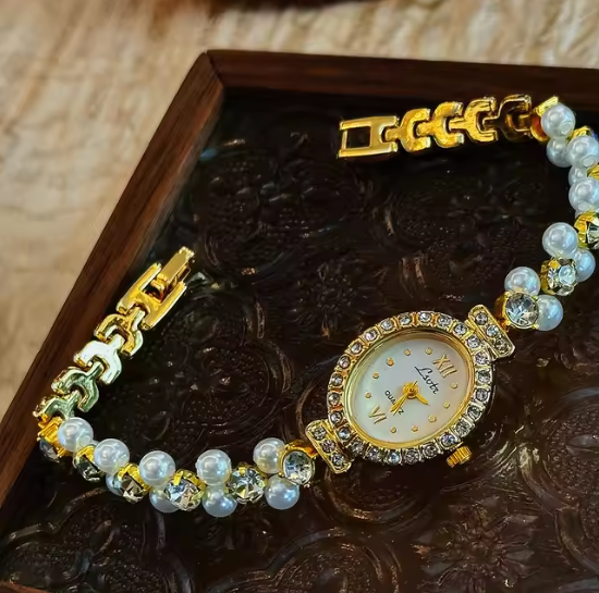 Gold-tone oval dial women’s watch with pearl and diamond crystal bracelet band by Le Belle Heure