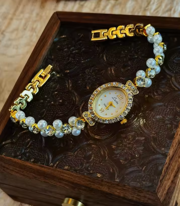 Gold-tone oval dial women’s watch with pearl and diamond crystal bracelet band by Le Belle Heure