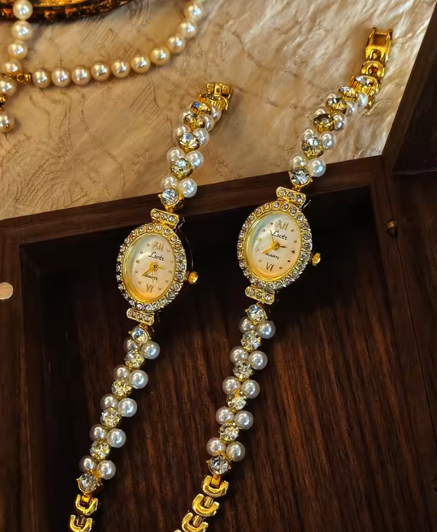 Gold-tone oval dial women’s watch with pearl and diamond crystal bracelet band by Le Belle Heure