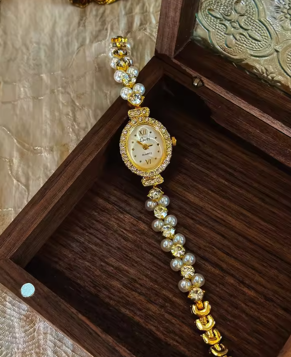 Gold-tone oval dial women’s watch with pearl and diamond crystal bracelet band by Le Belle Heure
