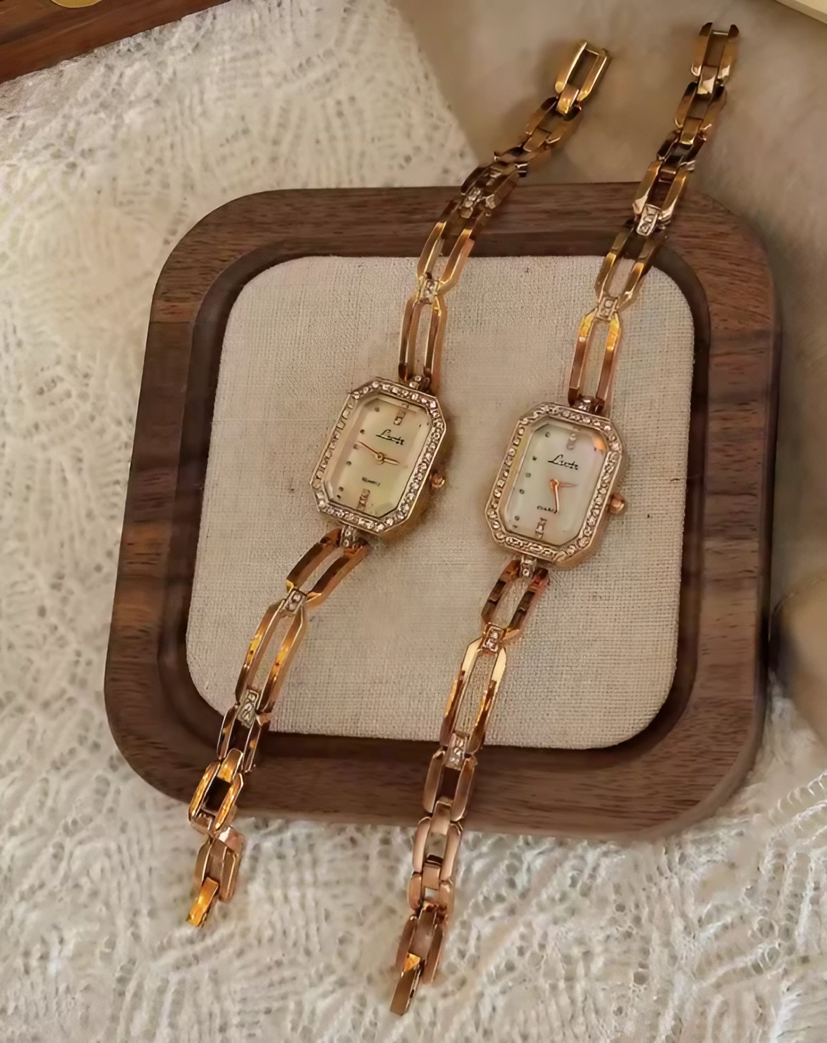 Rose gold rectangular bracelet watch with diamond crystal bezel and open-link chain band for women by Le Belle Heure
