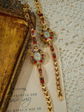 Gold oval dial ladies bracelet watch with multicolour ruby, amber, green and crystal square gemstone bezel and coloured link chain by Le Belle Heure