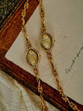 Gold twisted rope and flower knot chain bracelet watch with champagne oval dial and diamond-like hour markers for women by Le Belle Heure