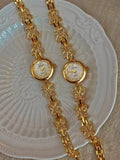 Gold crystal rhinestone butterfly link bracelet watch with mother-of-pearl round dial and Arabic numerals for women by Le Belle Heure