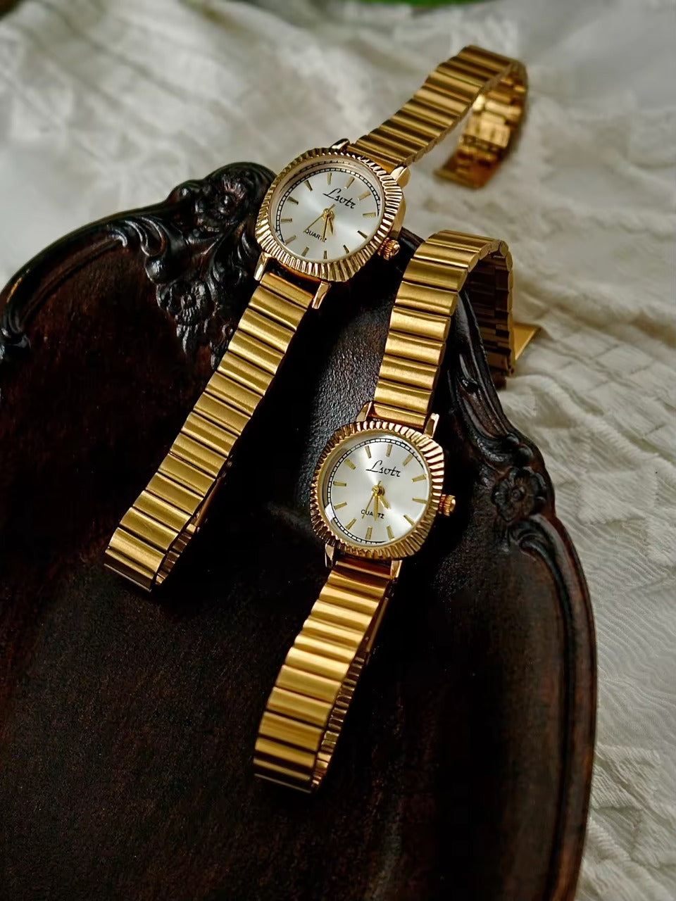 gold ribbed coin-edge bezel flex band watch with clear oval dial for women by Le Belle Heure