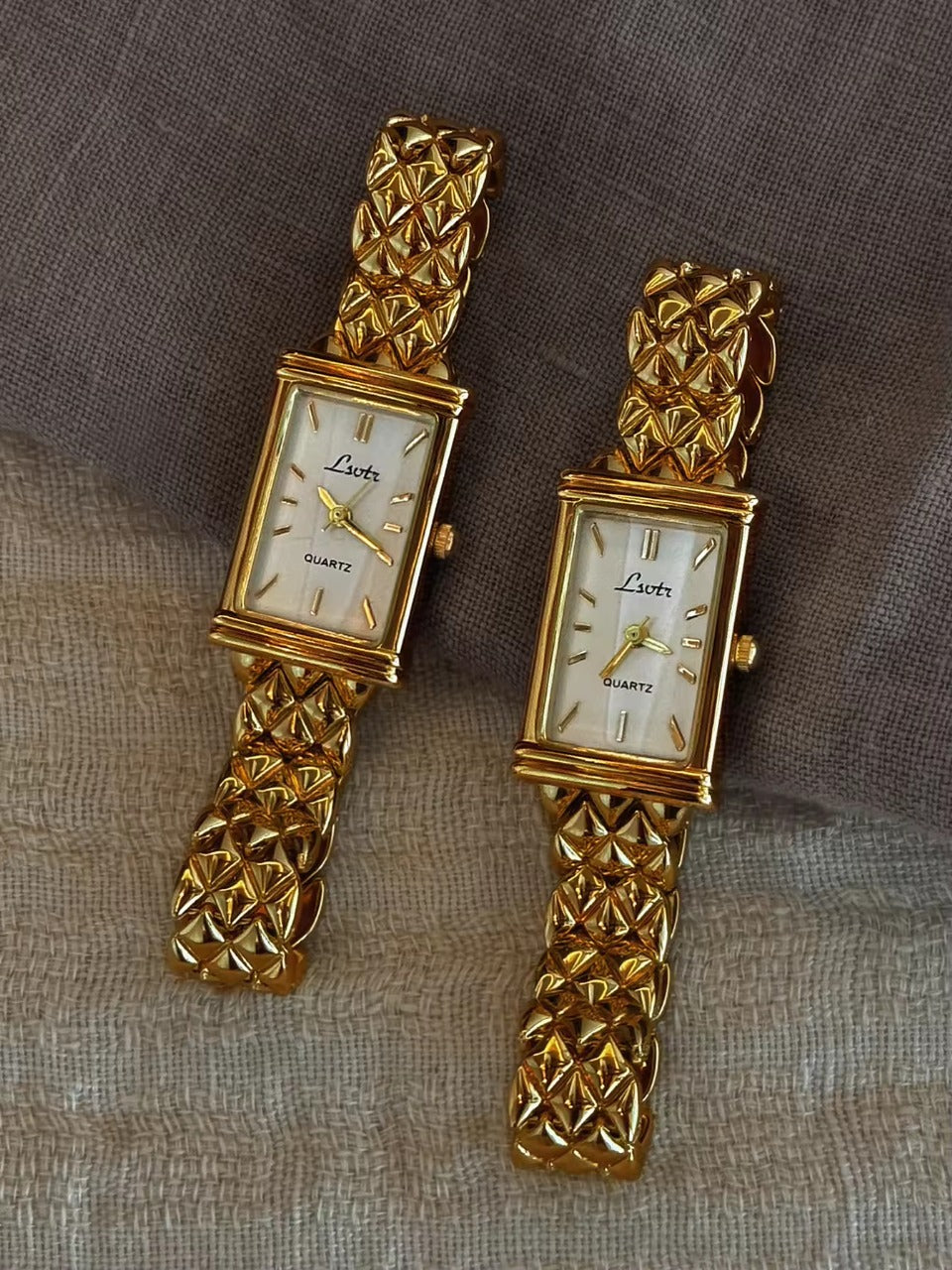 Gold pyramid quilted stud chain wide bracelet watch with white rectangular dial and gold baton hour markers for women by Le Belle Heure