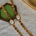 Gold XO link bracelet watch with mother-of-pearl oval dial and multicolour oval gemstones in ruby, amethyst, peridot and citrine for women by Le Belle Heure