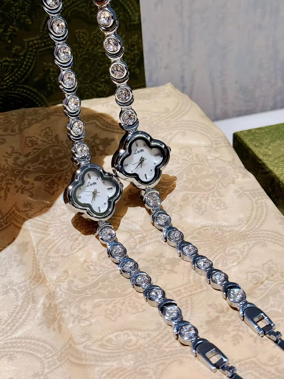 Le Belle Heure women’s silver clover quartz watch with crystal tennis bracelet strap on silk background

silver clover watch, tennis bracelet watch women, elegant ladies quartz watch, crystal jewelry watch, clover bracelet watch gift