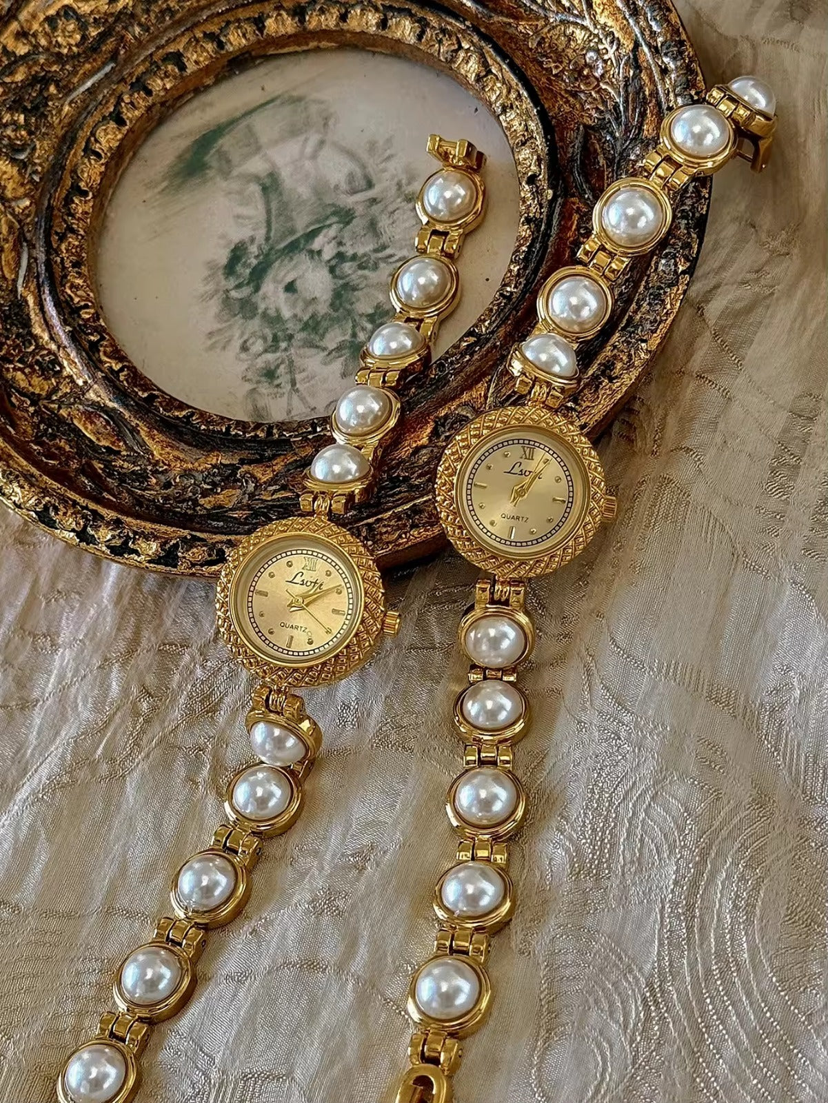 Gold pearl bracelet watch styled on antique gold frame tray – Le Belle Heure women’s watch