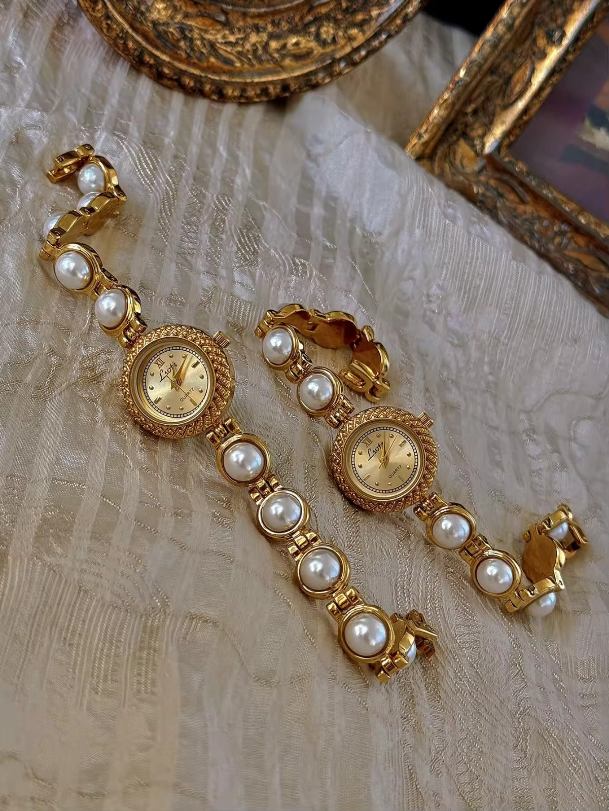 Gold pearl bracelet watch styled on antique gold frame tray – Le Belle Heure women’s watch