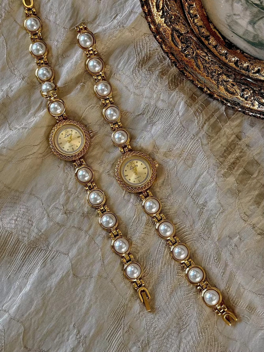 Gold pearl bracelet watch styled on antique gold frame tray – Le Belle Heure women’s watch