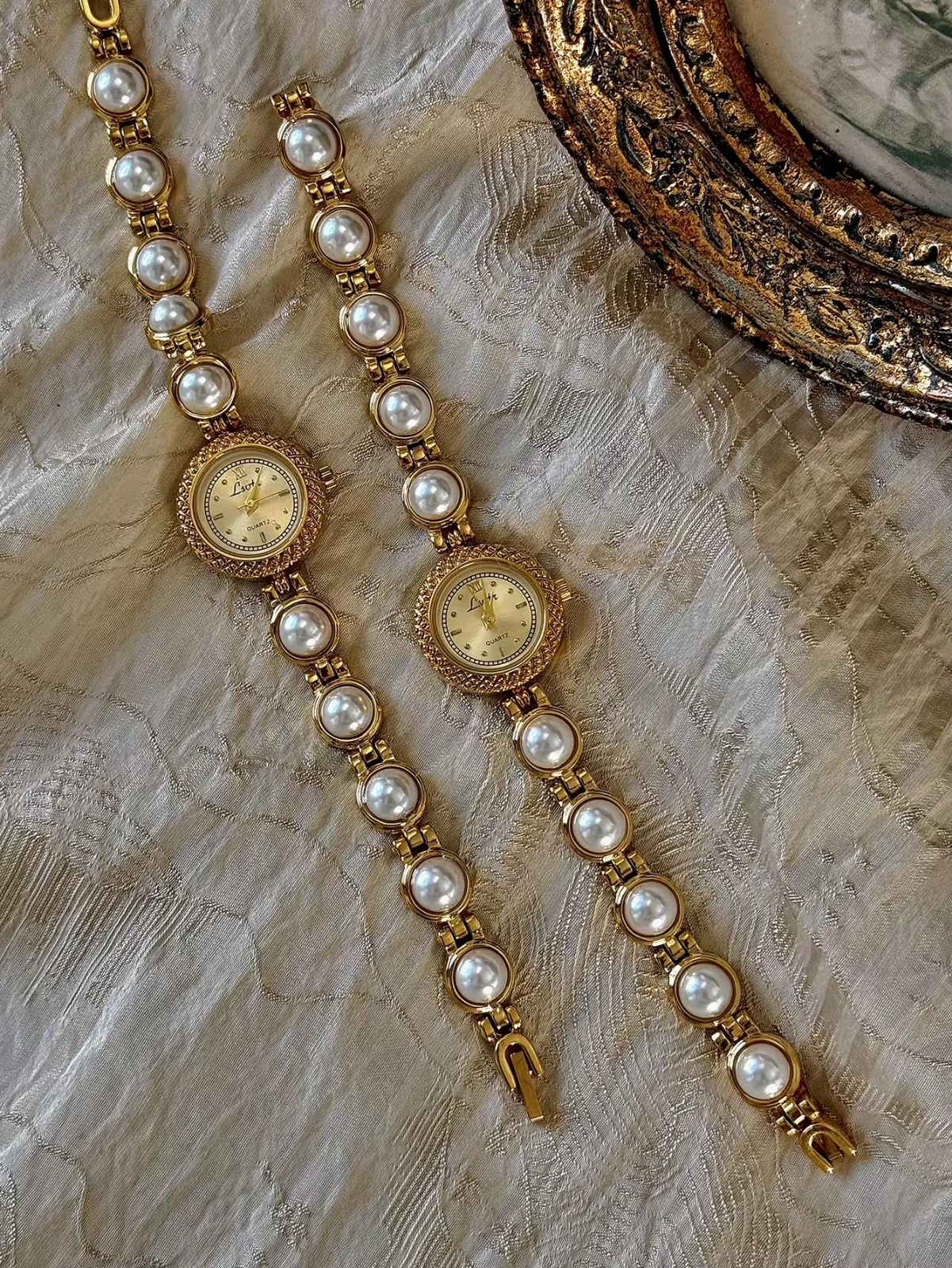 Gold pearl bracelet watch styled on antique gold frame tray – Le Belle Heure women’s watch