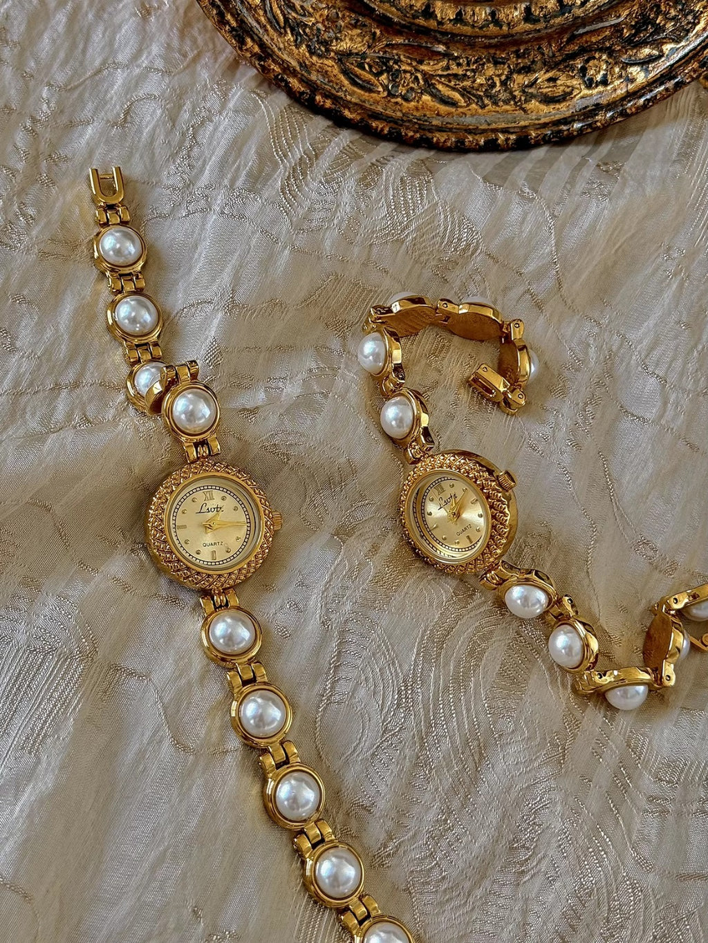 Gold pearl bracelet watch styled on antique gold frame tray – Le Belle Heure women’s watch