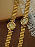 Gold domed oval watch with Roman numeral champagne dial, double
bar lug case connectors and wide ribbed accordion flex band for women by Le Belle Heure