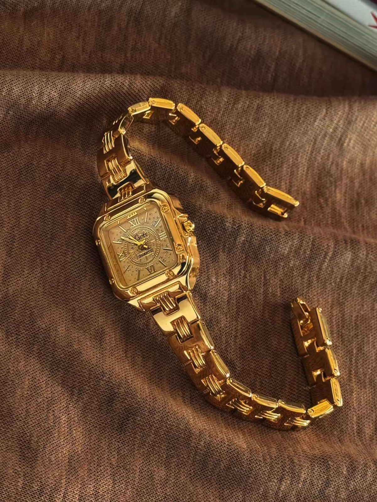 Gold square Roman numeral textured sunburst dial watch with screw
corner accents and wide structured woven link chain bracelet for women by Le Belle Heure