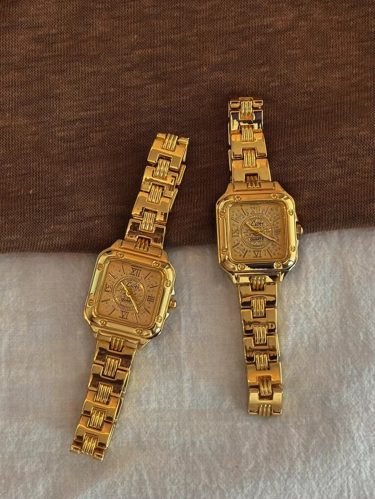 Gold square Roman numeral textured sunburst dial watch with screw
corner accents and wide structured woven link chain bracelet for women by Le Belle Heure