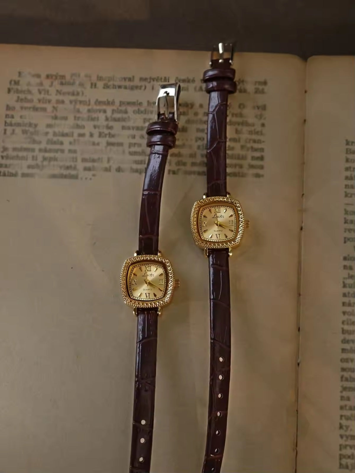 Gold cushion square watch with rope-twist crystal bezel, sunburst
Roman numeral champagne dial and slim dark chocolate crocodile texture leather strap for women by Le Belle Heure