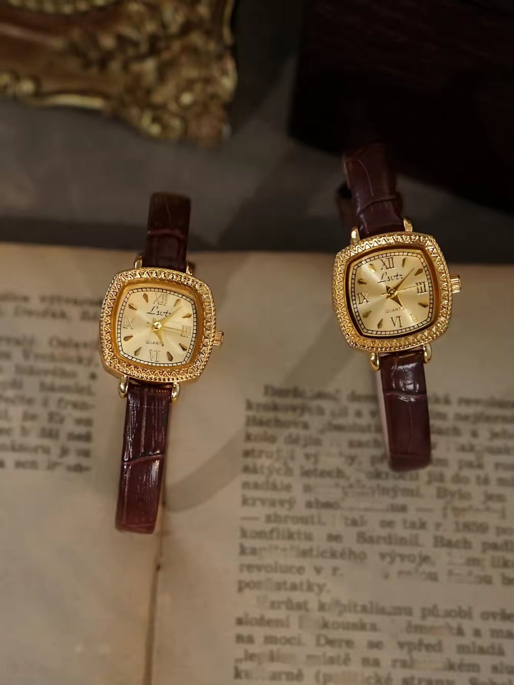 Gold cushion square watch with rope-twist crystal bezel, sunburst
Roman numeral champagne dial and slim dark chocolate crocodile texture leather strap for women by Le Belle Heure