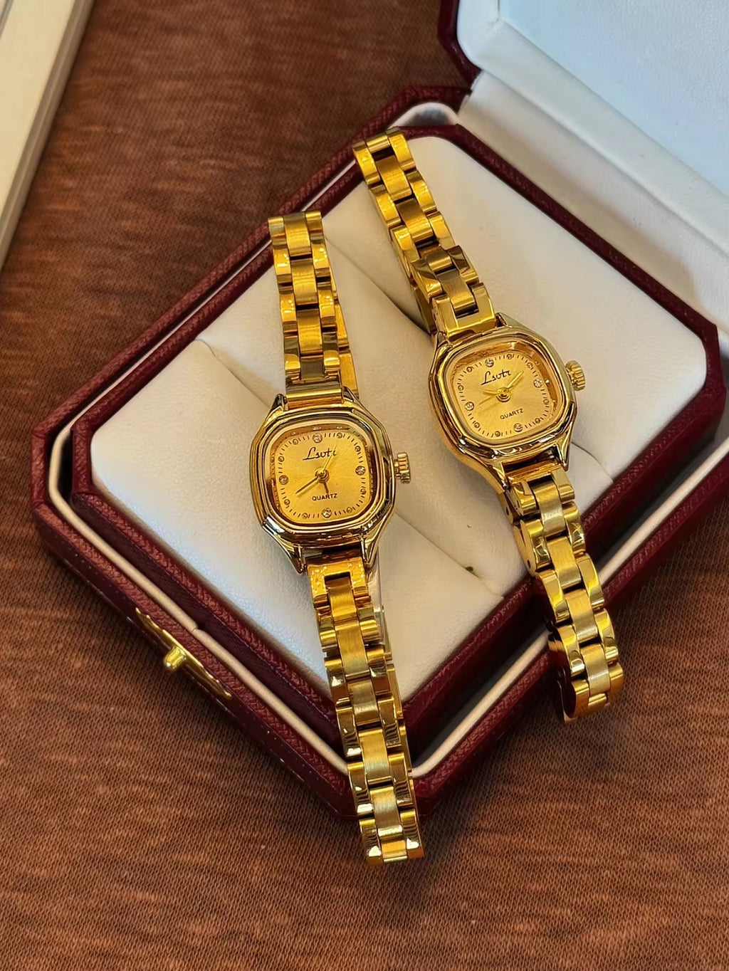 Women’s gold cushion square quartz watch with sunray dial and crystal accents — Le Belle Heure
