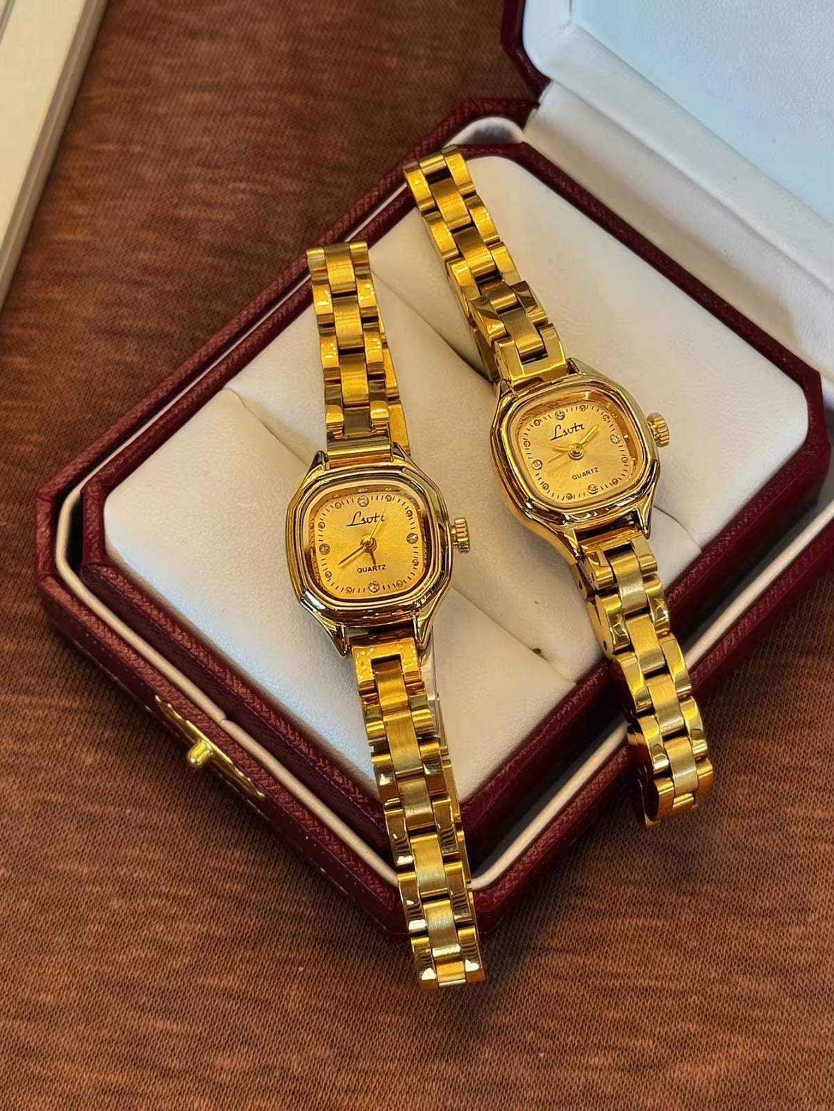 Women’s gold cushion square quartz watch with sunray dial and crystal accents — Le Belle Heure