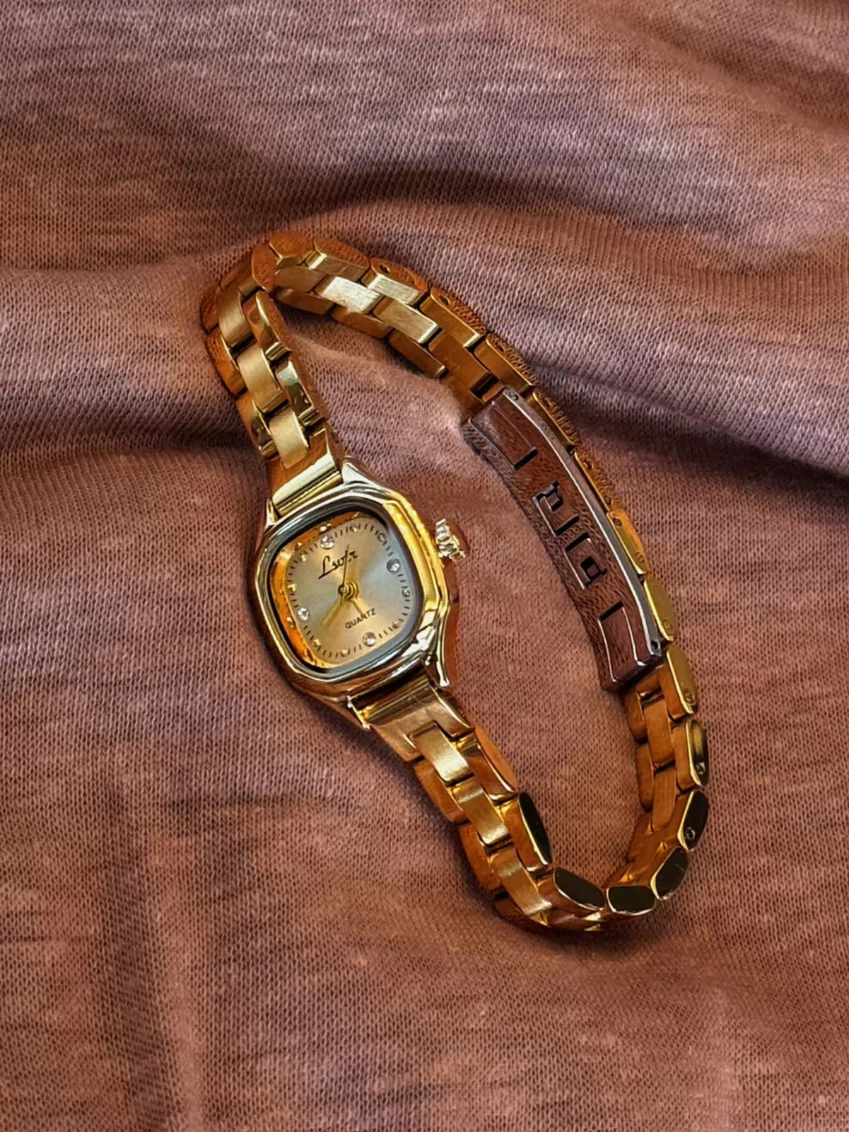 Women’s gold cushion square quartz watch with sunray dial and crystal accents — Le Belle Heure