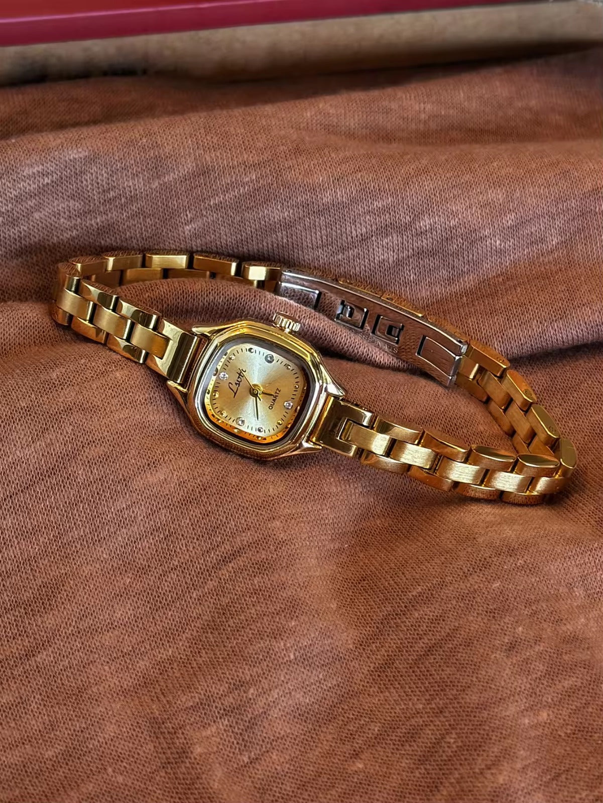 Women’s gold cushion square quartz watch with sunray dial and crystal accents — Le Belle Heure