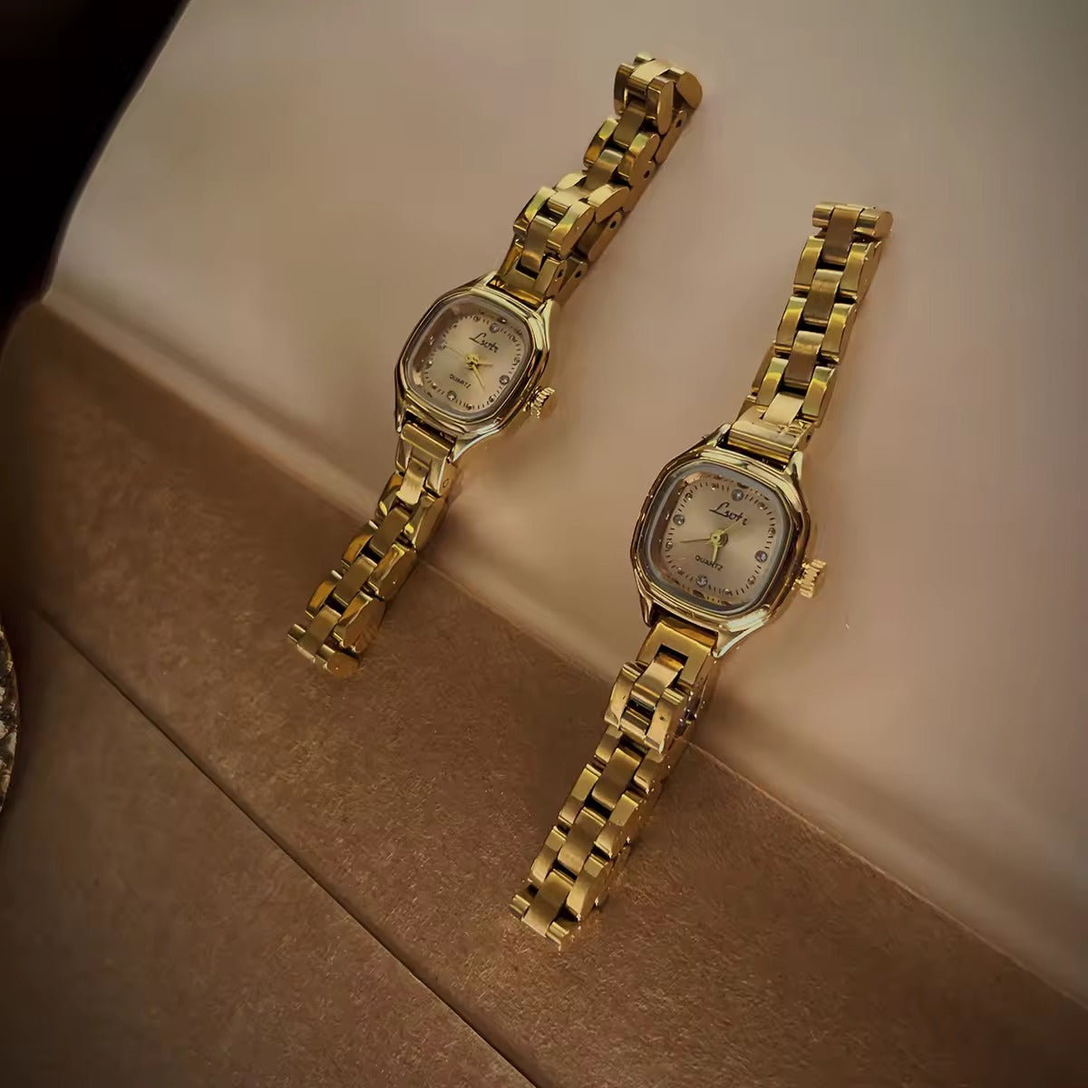 Women’s gold cushion square quartz watch with sunray dial and crystal accents — Le Belle Heure