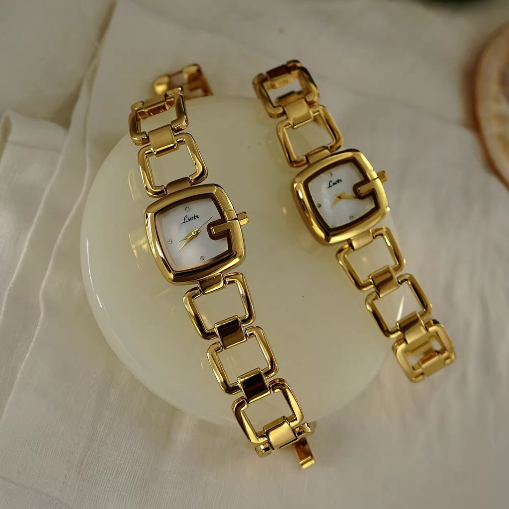 Women’s silver cushion square watch with black mother of pearl dial and open
square-link bracelet — Le Belle Heure