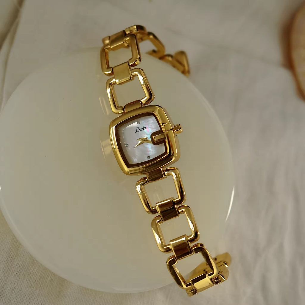 Women’s silver cushion square watch with black mother of pearl dial and open
square-link bracelet — Le Belle Heure