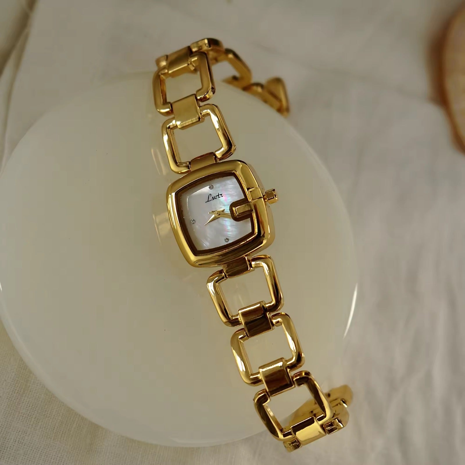 Women’s silver cushion square watch with black mother of pearl dial and open
square-link bracelet — Le Belle Heure