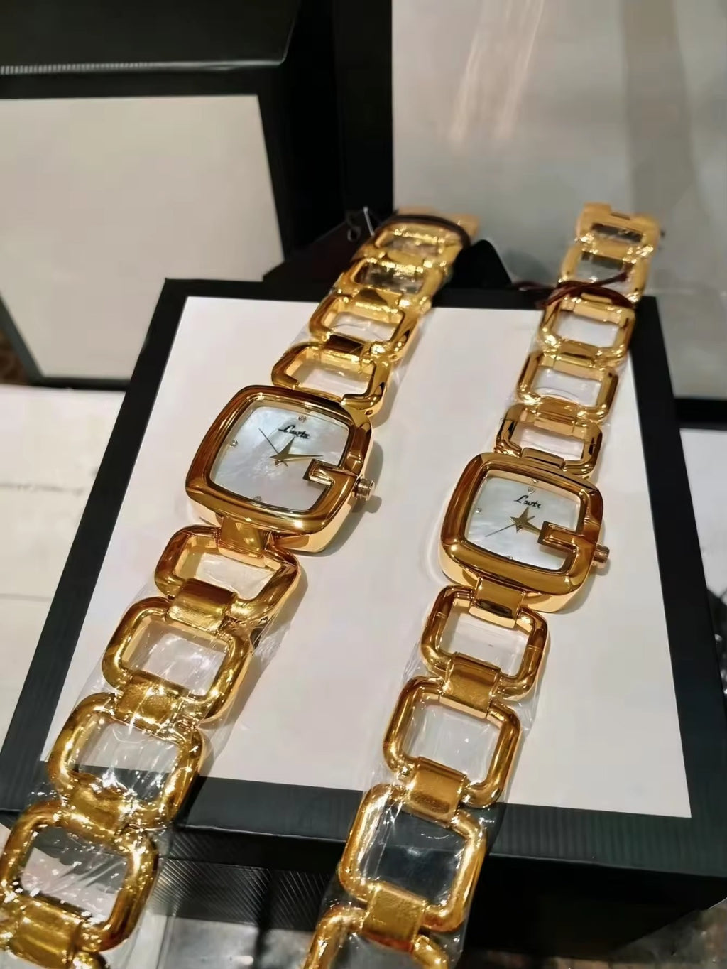 Women’s silver cushion square watch with black mother of pearl dial and open
square-link bracelet — Le Belle Heure