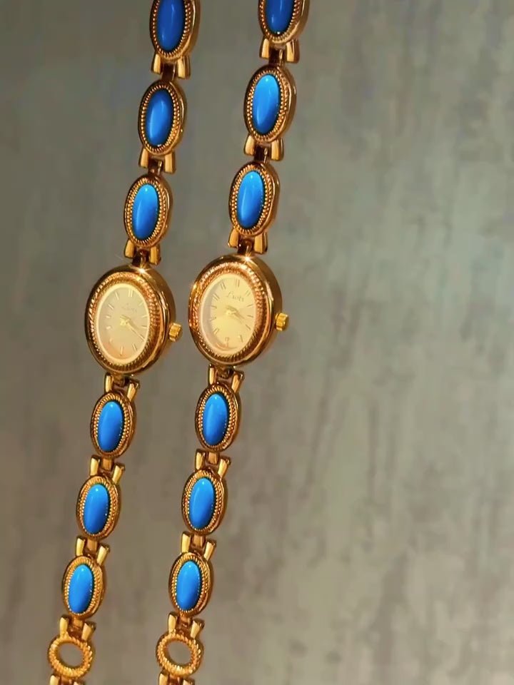 Gold rope-edge bracelet watch with vivid turquoise oval cabochon stone links and champagne oval dial for women by Le Belle Heure